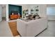 Relaxing living room with a built-in media wall and access to the pool at 9217 Hidden Bay Ln, Orlando, FL 32819