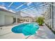 Large, refreshing swimming pool with screened enclosure at 9217 Hidden Bay Ln, Orlando, FL 32819