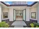 Elegant entry with glass double doors opening to a bright and spacious interior at 9217 Hidden Bay Ln, Orlando, FL 32819