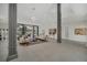 Open living room with contemporary furniture, high ceilings, and large windows at 9217 Hidden Bay Ln, Orlando, FL 32819