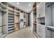 Spacious walk-in closet with ample shelving and hanging space at 9217 Hidden Bay Ln, Orlando, FL 32819