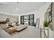 Spacious living room featuring contemporary furniture and access to the pool at 9217 Hidden Bay Ln, Orlando, FL 32819