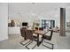 Open dining area showcasing a stylish table, modern chairs, and kitchen access at 9217 Hidden Bay Ln, Orlando, FL 32819