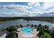 Community pool with surrounding landscaping at 2411 Luxor Dr, Kissimmee, FL 34747