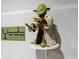 Collectible Yoda figure on display at 2411 Luxor Dr, Kissimmee, FL 34747