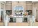 Gourmet kitchen boasts expansive island, high-end appliances, and abundant cabinetry at 4024 Grande Brick Loop # 9, Orlando, FL 32837