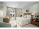 Main bedroom with a king-size bed and access to balcony at 4018 Grande Brick Loop # 10, Orlando, FL 32837