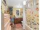 Bathroom with fish-themed shower curtain and wood vanity at 5715 Se 109Th St, Belleview, FL 34420