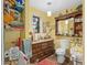 Bathroom boasts wood vanity, ample storage, and nautical theme at 5715 Se 109Th St, Belleview, FL 34420
