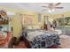 Bedroom with queen-size bed and access to backyard at 5715 Se 109Th St, Belleview, FL 34420