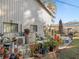 Large patio area with numerous potted plants and outdoor furniture at 5715 Se 109Th St, Belleview, FL 34420