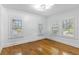 Spacious bedroom with hardwood floors and plantation shutters at 1310 Aloma Ave, Winter Park, FL 32789