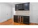 Built-in wet bar with granite countertop and wine cooler at 1310 Aloma Ave, Winter Park, FL 32789