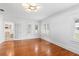 Spacious bedroom with hardwood floors and access to bathroom at 1310 Aloma Ave, Winter Park, FL 32789