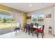 Bright dining area with table and chairs, view to backyard at 6030 Arbor Watch Loop, Orlando, FL 32829