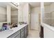 Double vanity bathroom with shower and plenty of storage at 6030 Arbor Watch Loop, Orlando, FL 32829