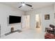 Well-lit bedroom with a large TV and ensuite bathroom access at 6030 Arbor Watch Loop, Orlando, FL 32829