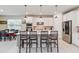 Bright kitchen features a large island with seating and stainless steel appliances at 6030 Arbor Watch Loop, Orlando, FL 32829