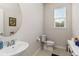 Clean and modern half bathroom with a pedestal sink and toilet at 6030 Arbor Watch Loop, Orlando, FL 32829