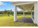 View of backyard, covered patio, and a grassy area at 6030 Arbor Watch Loop, Orlando, FL 32829