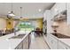 Open concept kitchen with large island, stainless steel appliances, and breakfast bar at 6030 Arbor Watch Loop, Orlando, FL 32829