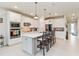Modern kitchen with white cabinets, quartz countertops, and stainless steel appliances at 6030 Arbor Watch Loop, Orlando, FL 32829