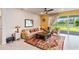 Relaxing living area featuring a comfortable sofa and access to the backyard at 6030 Arbor Watch Loop, Orlando, FL 32829