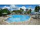 Community pool with gazebo and plenty of lounge chairs at 9149 Outlook Rock Trl, Windermere, FL 34786
