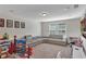 Spacious playroom with sectional sofa and lots of toys at 9149 Outlook Rock Trl, Windermere, FL 34786