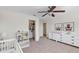 Bedroom with crib, dresser, and plenty of closet space at 9149 Outlook Rock Trl, Windermere, FL 34786
