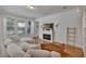Bright Gathering room featuring a cozy sectional sofa and fireplace at 9149 Outlook Rock Trl, Windermere, FL 34786