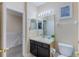 Simple bathroom with a dark vanity and a toilet at 2433 Caravelle Cir, Kissimmee, FL 34746