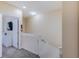 Upstairs hallway with doors to bedrooms and bathroom at 2433 Caravelle Cir, Kissimmee, FL 34746