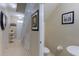 Clean half bathroom with pedestal sink and toilet at 2433 Caravelle Cir, Kissimmee, FL 34746