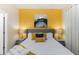 Bedroom with a queen-size bed and yellow accents at 2433 Caravelle Cir, Kissimmee, FL 34746