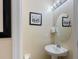 Small half bathroom with pedestal sink at 2433 Caravelle Cir, Kissimmee, FL 34746