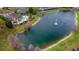 Community pool and lake view from above at 2433 Caravelle Cir, Kissimmee, FL 34746