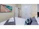 Bedroom with a queen bed and large TV at 2433 Caravelle Cir, Kissimmee, FL 34746