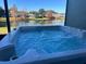 Enjoy this hot tub overlooking a tranquil lake at 2433 Caravelle Cir, Kissimmee, FL 34746