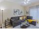 Living room with sectional sofa and coffee table at 2433 Caravelle Cir, Kissimmee, FL 34746