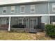 Screened patio with hot tub and table at 2433 Caravelle Cir, Kissimmee, FL 34746