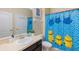Bathroom with a Minion-themed shower curtain at 2433 Caravelle Cir, Kissimmee, FL 34746