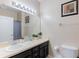 Bathroom with vanity, mirror, and toilet at 2433 Caravelle Cir, Kissimmee, FL 34746