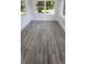 Sunroom with gray vinyl flooring and large windows at 635 Maitland Ave, Altamonte Springs, FL 32701