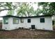 Back of the house features a freshly painted white exterior and black trim at 635 Maitland Ave, Altamonte Springs, FL 32701