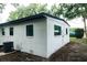 Back of the house showcases newly painted white exterior and updated windows at 635 Maitland Ave, Altamonte Springs, FL 32701