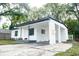 Newly renovated home, featuring a clean white exterior and carport at 635 Maitland Ave, Altamonte Springs, FL 32701