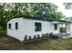 Side view of renovated white house at 635 Maitland Ave, Altamonte Springs, FL 32701