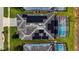 Aerial view of house with solar panels and pool at 8911 Stinger Dr, Champions Gate, FL 33896