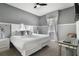 Spacious bedroom with a king-size bed and a sitting area at 8911 Stinger Dr, Champions Gate, FL 33896